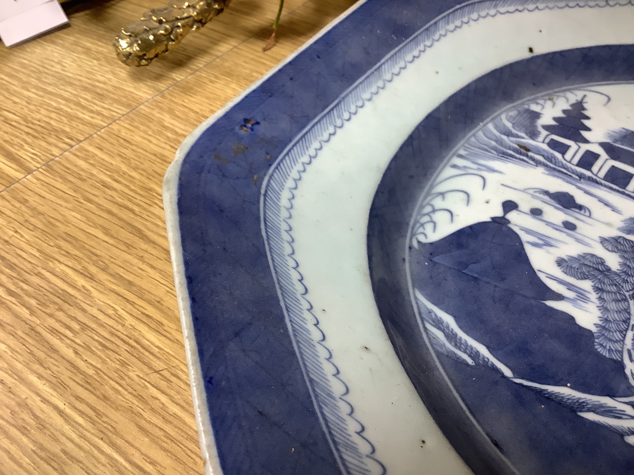 A 19th century Chinese export blue and white plate, decorated with pagoda scenes, length 42cm